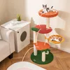 A cat tree with fruit-themed platforms is shown in a living room setting next to a white side table and a sofa. Podgląd zdjęcia produktu