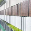 A close-up view of a fence with privacy screening strips. Produktbild-Vorschau