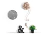 A wall with two clocks, an ampersand decoration, and a small potted plant. Produktbild-Vorschau