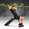 A man is performing sit-ups on an adjustable weight bench. The background features a smoky effect and large, neon yellow text that reads 'Stride'. Podgląd zdjęcia produktu