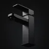 A black modern faucet on a black background. Podgląd zdjęcia produktu