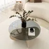 A modern living room scene with a glass coffee table. Produktbild-Vorschau
