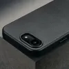 A close-up shot of the back of a black leather iPhone case, showing the camera cutout. Anteprima dell’immagine prodotto