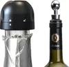 Two bottle stoppers are shown, one on a bottle and one on a bottle with foil. Anteprima dell’immagine prodotto