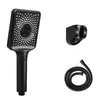 A black handheld showerhead with its hose and wall mount are displayed against a white background. Anteprima dell’immagine prodotto