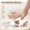 A hand pressing into a soft, white material, with smaller inset images showing fabric texture, fluffy material, and the material's resilience. Podgląd zdjęcia produktu