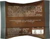 The image shows the back of a coffee capsule packaging with text and recycling symbols. Voir les images du produit