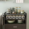 A kitchen cart with shelves displaying various kitchenware and storage containers. Náhled obrázku produktu