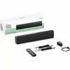 A product shot of a soundbar and its accessories, along with its packaging. Voir les images du produit