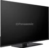 A black Panasonic TV is shown from a side angle on a black stand. Náhľad obrázku produktu