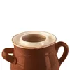 A close-up view of the top portion of a brown ceramic jar with two handles and a cream-colored lid insert. Náhled obrázku produktu