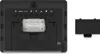 The back of a weather station is shown, with the battery compartment open and two AA batteries installed. A separate battery cover is placed to the right. Produktbild-Vorschau