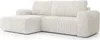 A cream-colored sectional sofa with a chaise lounge, shown from a three-quarter angle against a white background. Podgląd zdjęcia produktu