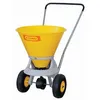 A yellow and gray wheeled spreader with a black handle and wheels, set against a white background. Náhled obrázku produktu