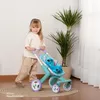 A young girl is pushing a toy stroller with a Stitch plush toy inside. Náhľad obrázku produktu