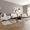 A living room scene with a sofa set, coffee table, and artwork on the wall. Produktbild-Vorschau