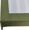 A close-up view of the corner of a green upholstered bed frame, showing the corduroy texture and a white fabric covering the mattress area. Produktbild-Vorschau