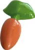 A toy carrot with green leaves on a white background. Náhled obrázku produktu