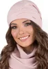 A woman wearing a pink beanie and scarf. Produktbild-Vorschau