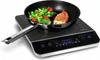 A black induction cooktop with a frying pan containing food. Anteprima dell’immagine prodotto
