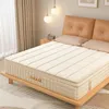 A bedroom scene with a mattress on a bed frame, pillows, and curtains. Produktbild-Vorschau