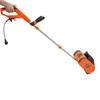 A hand holding an electric snow blower. Podgląd zdjęcia produktu