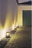 Outdoor pathway lighting next to a wall and garage. Voir les images du produit