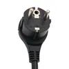 A close-up view of a black power plug with two metal prongs. Produktbild-Vorschau