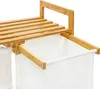 Close-up of a bamboo laundry basket with white fabric liners. Náhled obrázku produktu