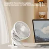A white clip-on fan sits on a desk next to an open laptop. Produktbild-Vorschau