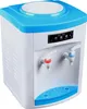 A white and blue water dispenser with a digital display and two spouts. Podgląd zdjęcia produktu