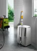 A white dehumidifier in what appears to be a garage or workshop setting, with a toolbox and a ladder visible in the background. Anteprima dell’immagine prodotto