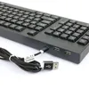 A close-up view of a black keyboard with a USB cable plugged into one of its ports. Náhled obrázku produktu
