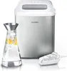A product shot of an ice maker with a carafe of water and ice scoop. Podgląd zdjęcia produktu