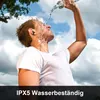 A man is pouring water on his face outdoors under a cloudy sky. Produktbild-Vorschau