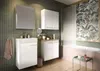 A modern bathroom with green tiled walls, a white vanity, a mirror, and a bathtub with tropical-themed wallpaper. Produktbild-Vorschau