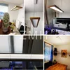 A collage of images showing a wooden LED pendant light in various settings, including a dining room, near an aquarium, and with a remote control. Náhled obrázku produktu