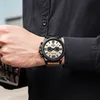 A man wearing a black shirt and a CURREN watch on his wrist. Produktbild-Vorschau