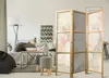 A room divider is placed in a living room setting, partially obscuring a sofa and coffee table. Anteprima dell’immagine prodotto
