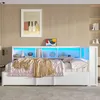 A white daybed with storage drawers and a headboard featuring LED lighting and shelves, with a pink quilted comforter and a gold throw blanket. Náhled obrázku produktu