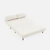 A cream-colored sofa bed with two pillows on a white background. Produktbild-Vorschau