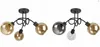 Two ceiling lights with black metal frames and glass shades are shown against a white background. The left light has three amber glass shades. The right light has one dark gray glass shade and two amber glass shades. Produktbild-Vorschau