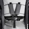 A close-up view of a stroller's safety harness. Produktbild-Vorschau