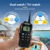 A hand holding a marine radio with a background of a boat on the water. Anteprima dell’immagine prodotto
