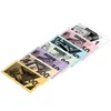 A collection of Monopoly money bills of different denominations, fanned out and arranged diagonally on a white background. Produktbild-Vorschau