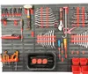 A tool board with various tools organized on it. Produktbild-Vorschau