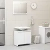 A clean and modern bathroom setting with a vanity, sink, mirror, and washing machine. Produktbild-Vorschau