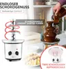 A chocolate fountain is being filled with chocolate, with a smaller chocolate fountain and fruit platter in the foreground. Podgląd zdjęcia produktu