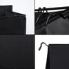 A collage of four close-up images showing details of a black laundry basket. Voir les images du produit