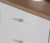 Close-up view of a white dresser with a wooden top and silver handles. Produktbild-Vorschau